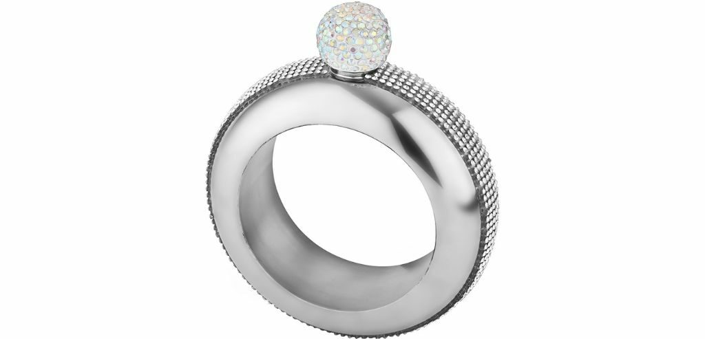 Silver bracelet flask with a gemstone-encrusted cap.