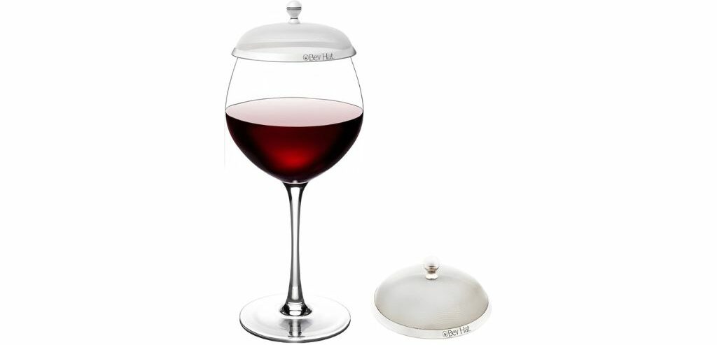 Wine glass with a stylish metal beverage hats