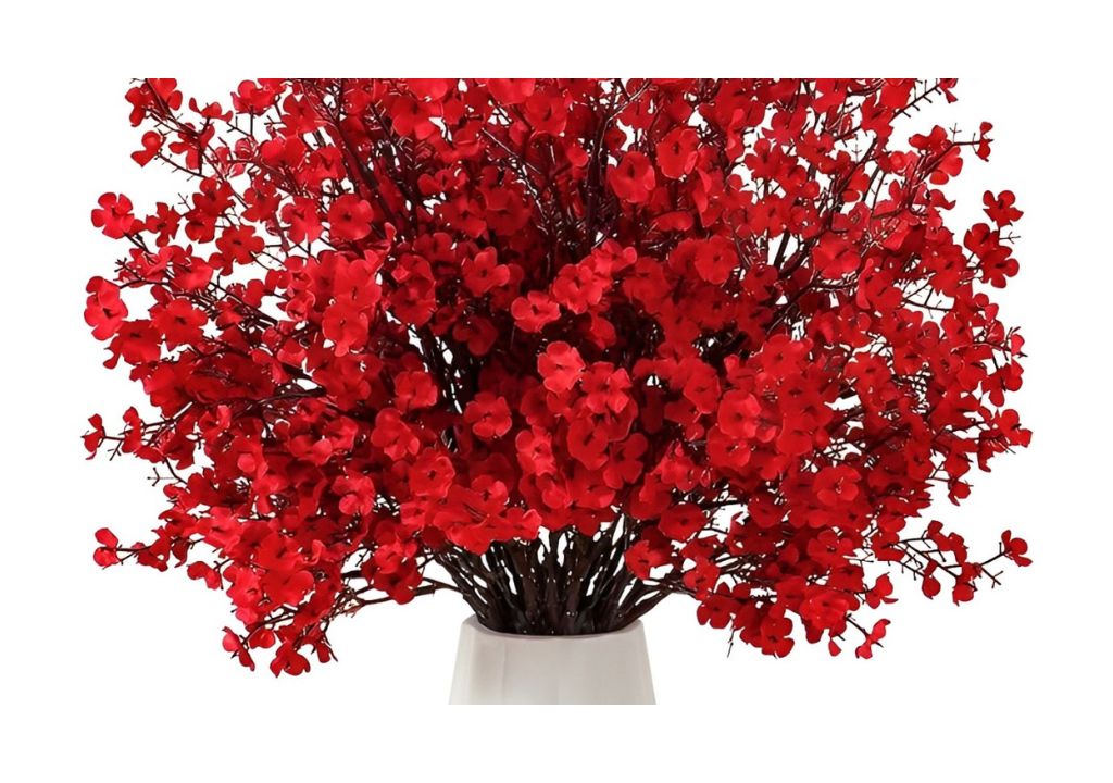 Red custom floral arrangement in a white vase.