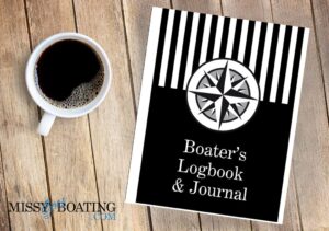 Boater's logbook with a coffee on a wood desk