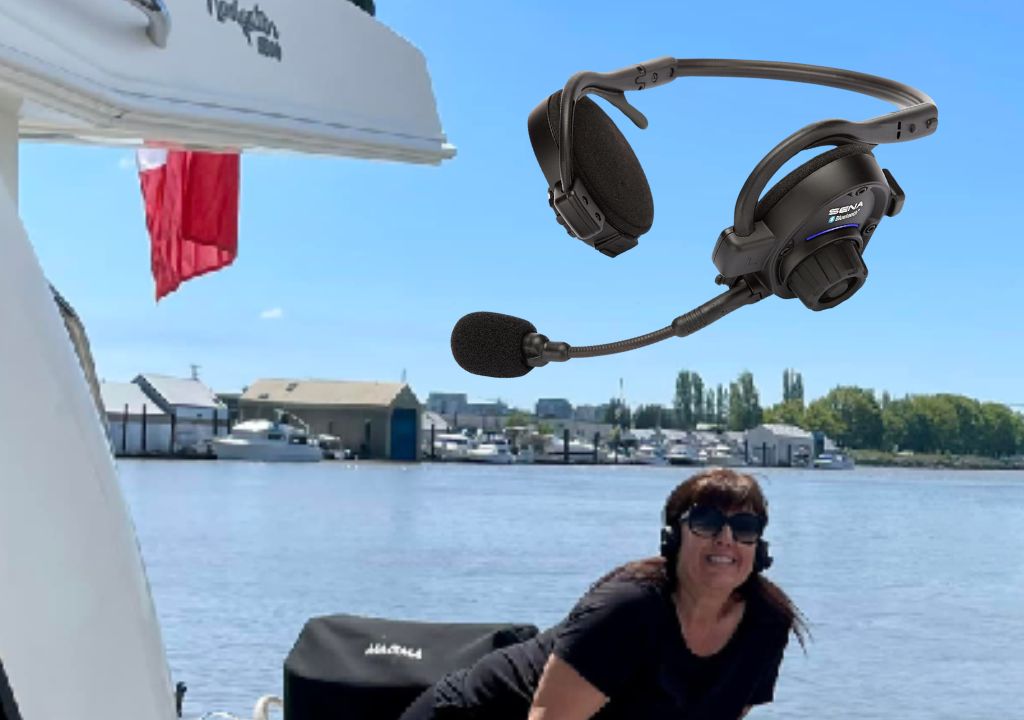 a woman on a boat wearing a microphone and headset