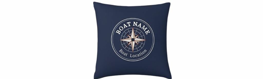 Navy blue custom pillow cover featuring a compass design with personalized boat name and location.