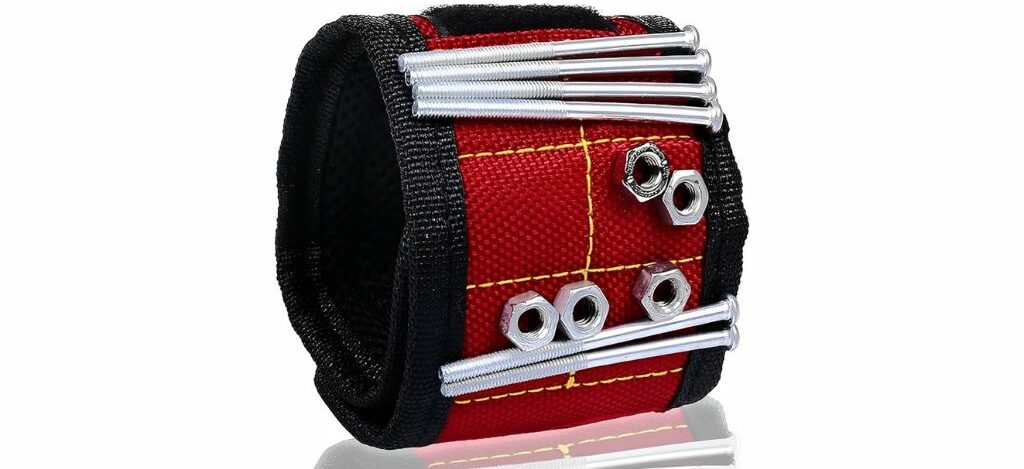 Red and black magnetic wristband tool holder for screws, nuts, and bolts for easy access during work.