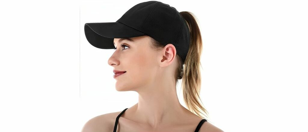 Side profile of a woman wearing a Pony Tail Ball Cap with a hole designed for a high ponytail, ideal for outdoor and sporty activities.