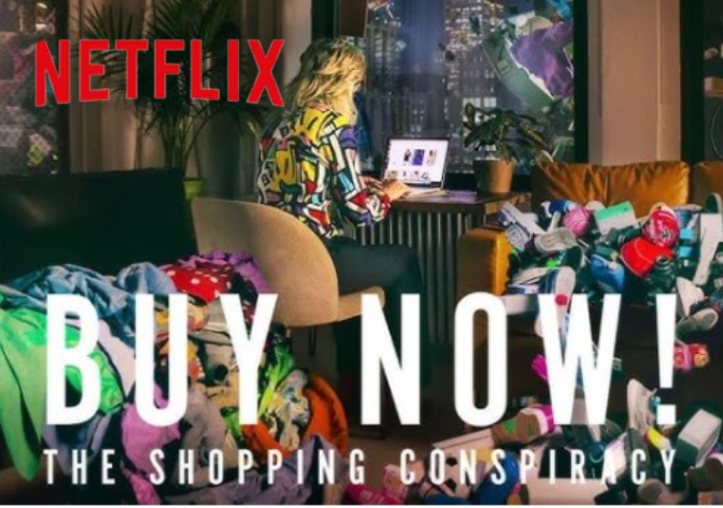 a woman sitting in a chair with a laptop