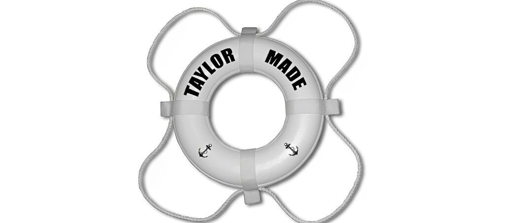 White life ring with "Taylor Made" lettering and anchor designs.