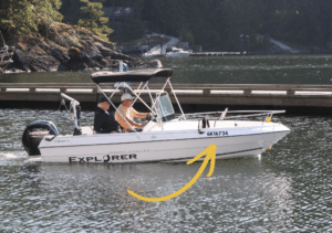 a boat showing the pleasure craft licence number on the bow